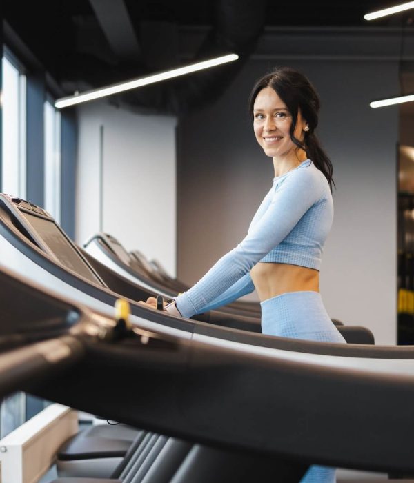 cheerful-fitness-girl-walking-on-a-treadmill-1.jpg
